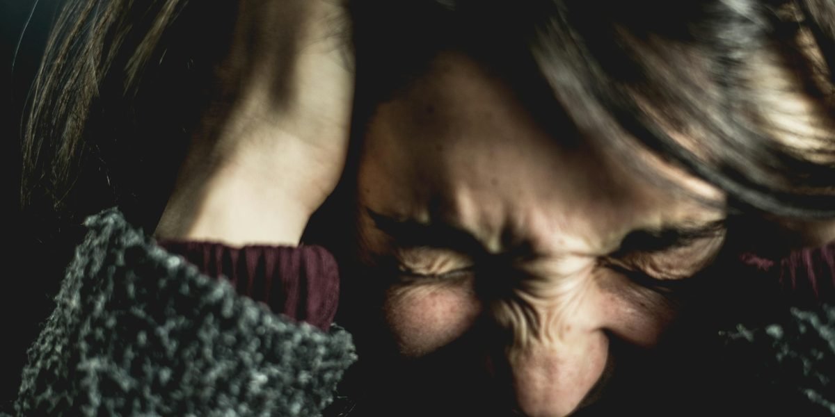 A person feeling overwhelmed by the sheer number of online course choices, seeking clarity and direction.