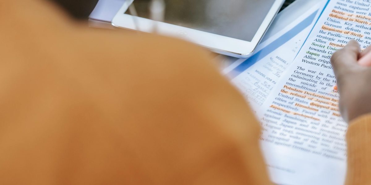 A person focused on studying, actively applying learning strategies to retain information effectively.