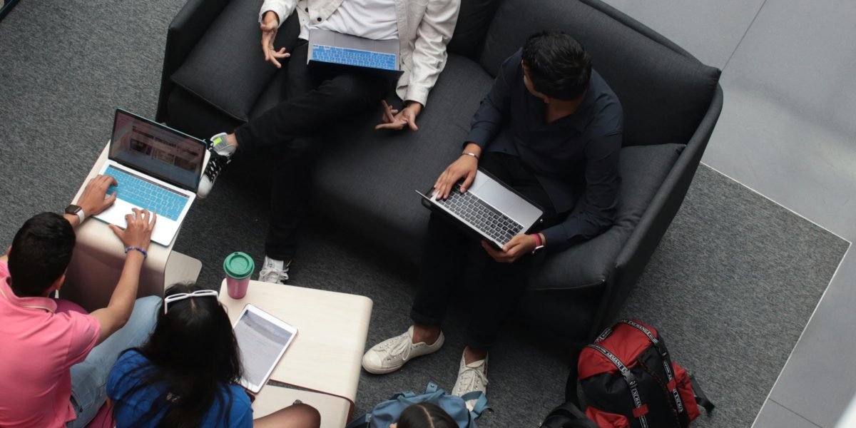 Students actively collaborating in a group, demonstrating hands-on engagement in a project-based learning environment.