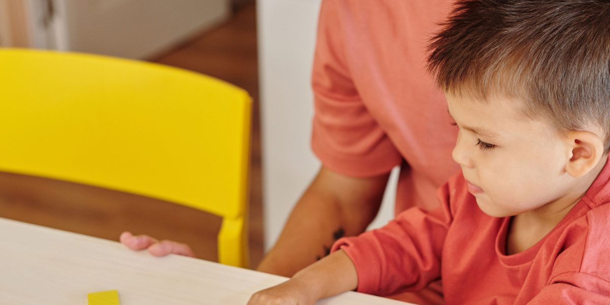 A parent and child actively engaged in a learning activity, demonstrating deep understanding.