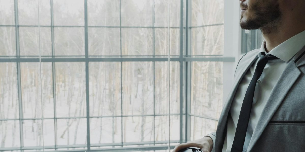 A person contemplating their future learning or career path, reflecting on the accessibility of education.