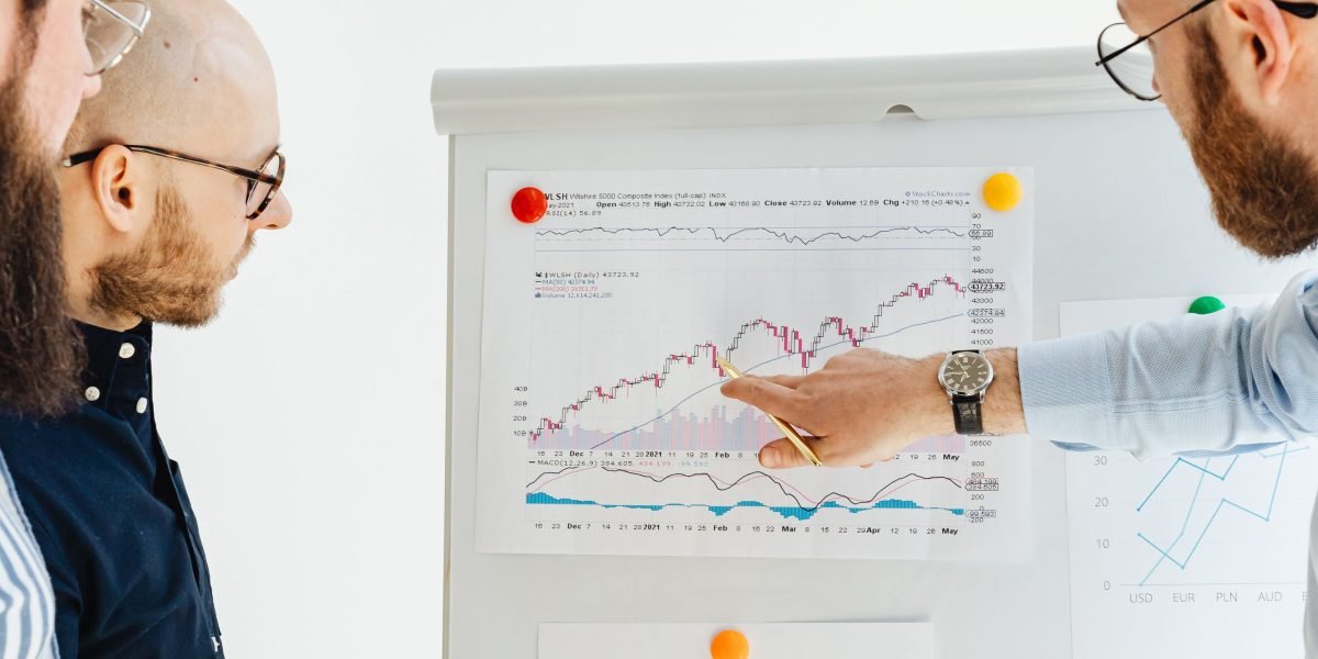A team reviews data analytics, working to interpret user behavior while being mindful of cognitive biases.
