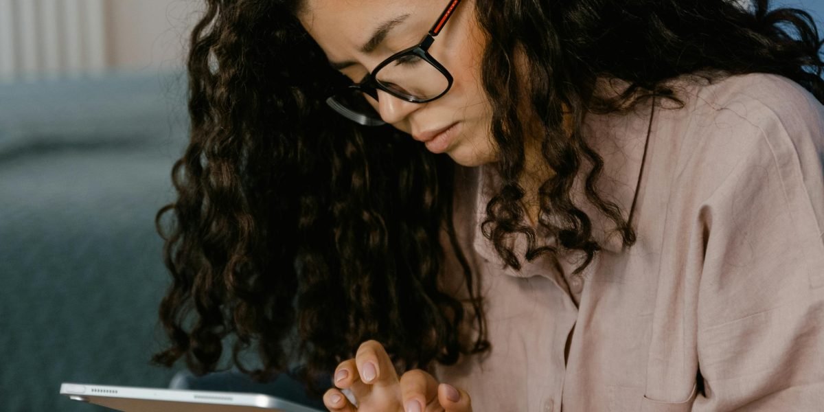 A person thoughtfully exploring various learning categories, seeking courses aligned with their interests in cognitive science.