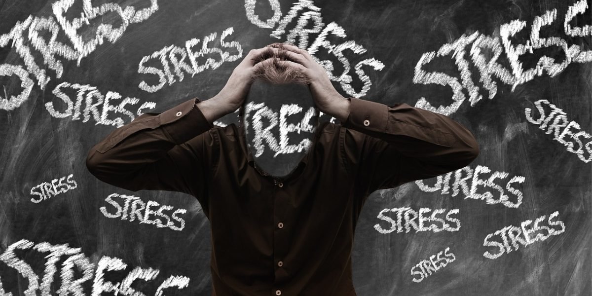 A person looking overwhelmed while studying, representing the struggle to retain information in today's information-rich environment.