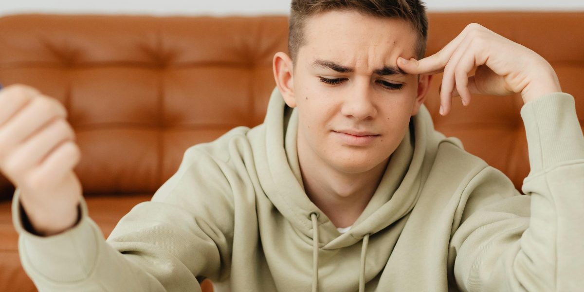 A child appears frustrated or confused while studying, illustrating the common challenge of information fading from memory.