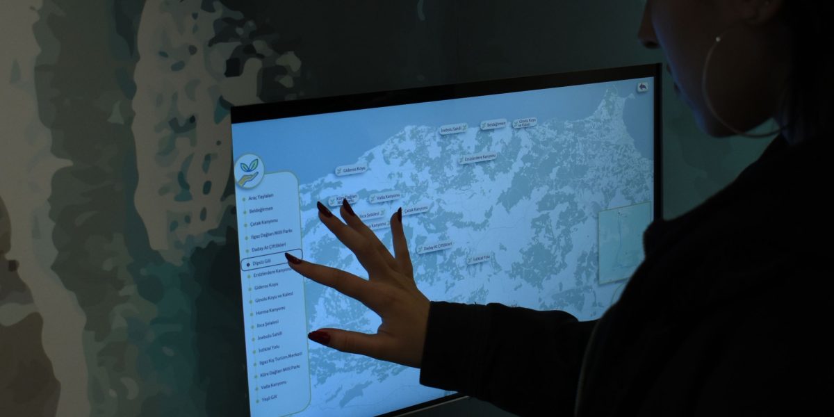 A person looking thoughtfully at a digital interface, reflecting ease of use.