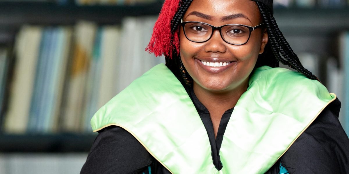 A confident student smiling, reflecting success and readiness for real-world scientific challenges.