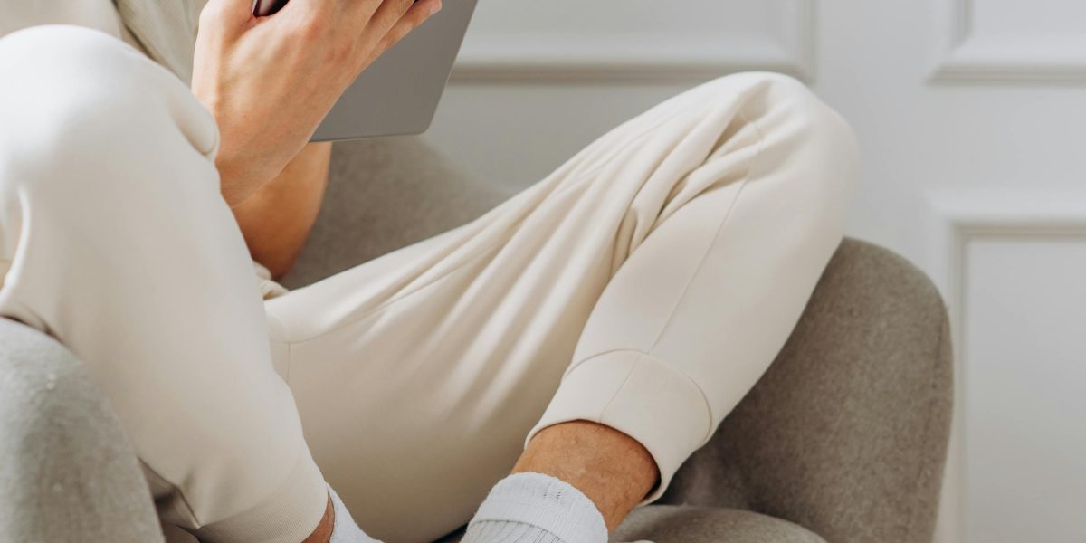 A person engaged in learning using a tablet, reflecting modern educational practices.