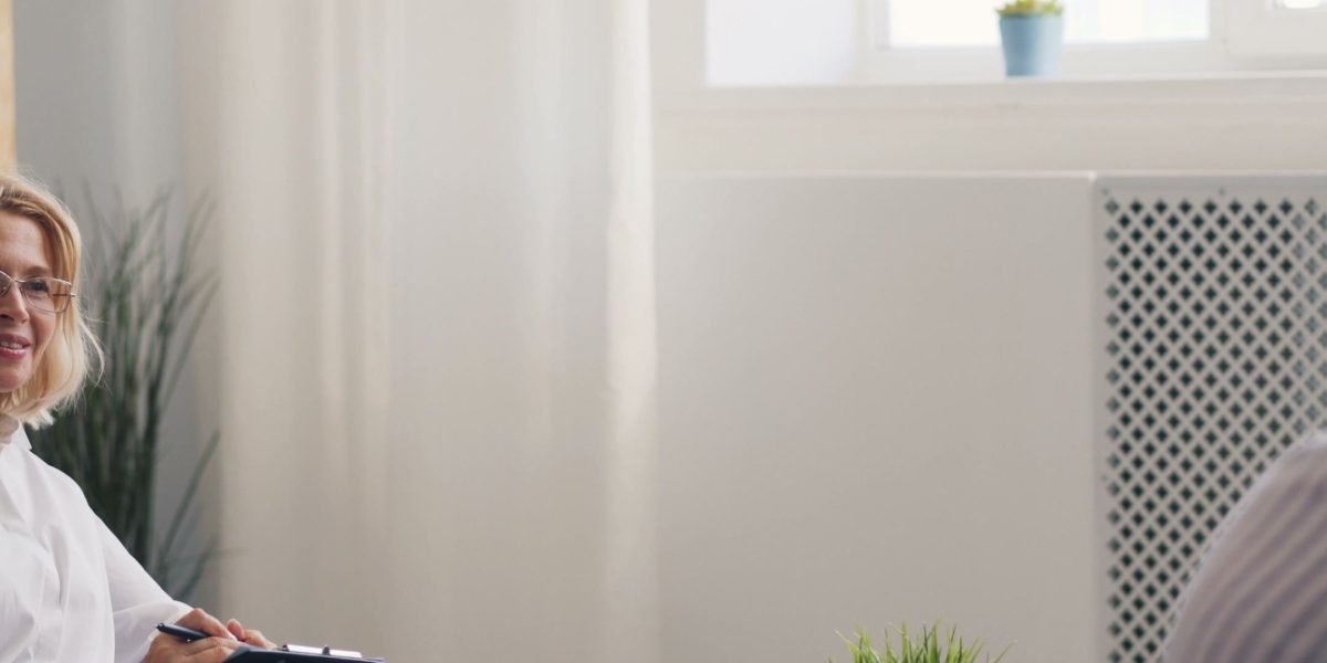 A person engaged in an open and honest conversation during a therapy consultation.