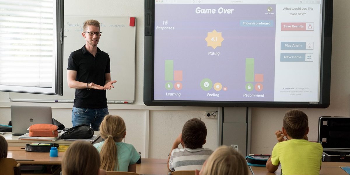 A student teacher actively interacting with preschoolers in a classroom setting, gaining practical experience.