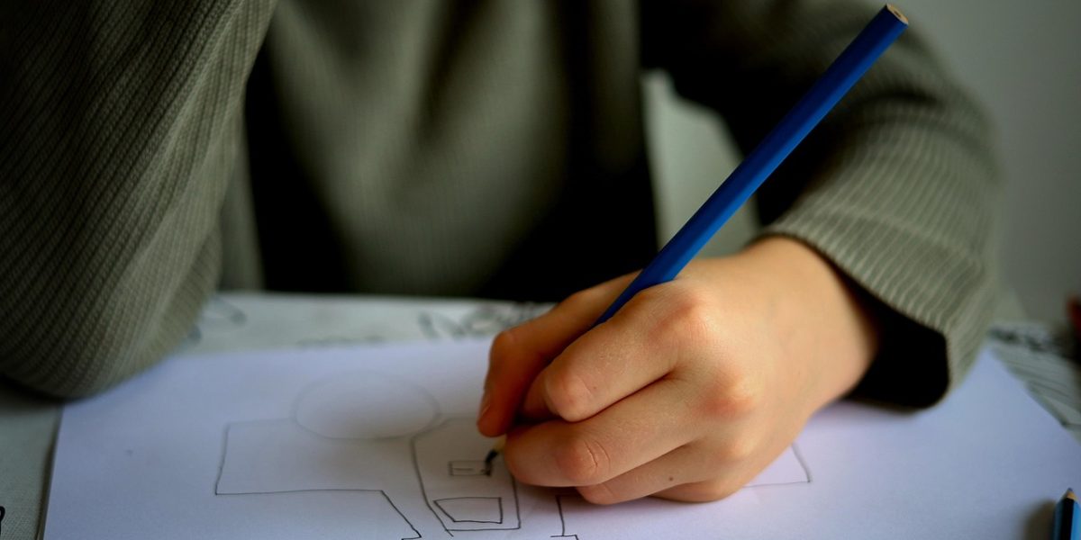 An educator thoughtfully plans a lesson, balancing engaging activities with core learning objectives.