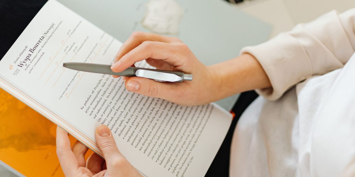 A person deeply engaged in reading, symbolizing the initial phase of research and discovery when choosing an online degree.