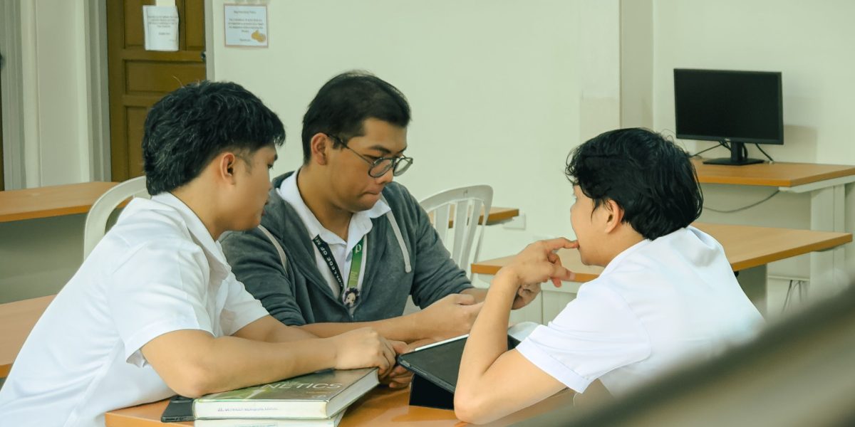 University leaders engaged in a collaborative discussion, emphasizing teamwork in academic decision-making.