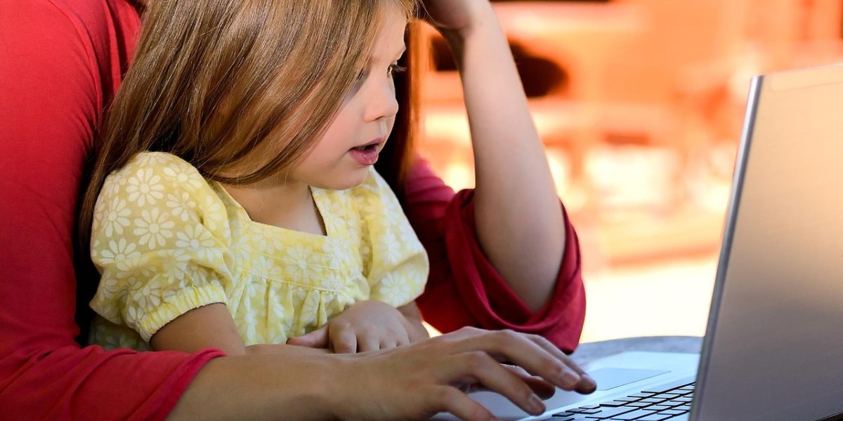 A child observes their parent, demonstrating the foundational human act of learning by watching.