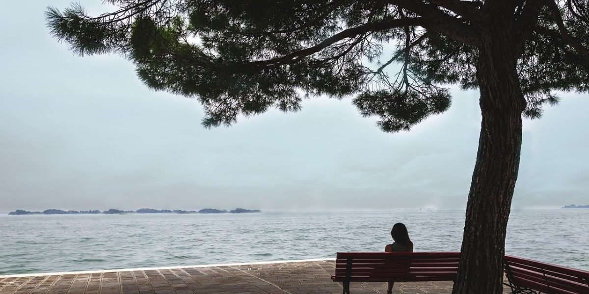 A person engaged in deep thought, reflecting the complex neural processes involved in observational learning.